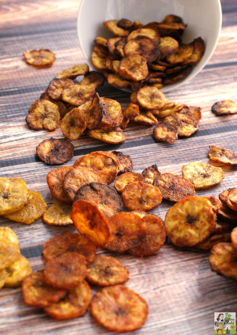 Spilled baked plantain chips on a tabletop.
