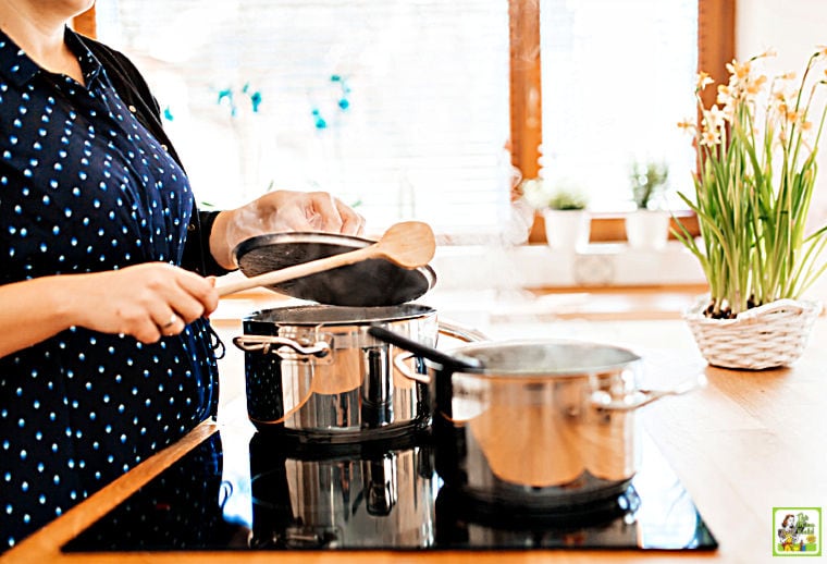 Meal being cooked in a modern kitchen on induction cooktop stove.