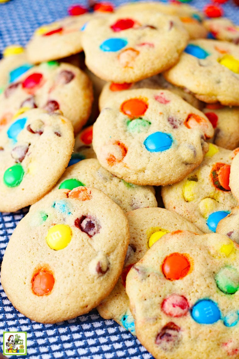 A closeup of a pile of M&M Chocolate Chip Cookies