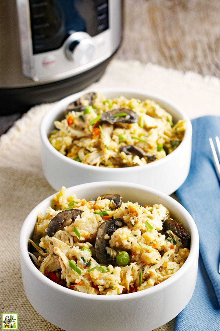 Bowls of chicken, rice, mushrooms, peas and carrots with an Instant Pot pressure cooker in the background