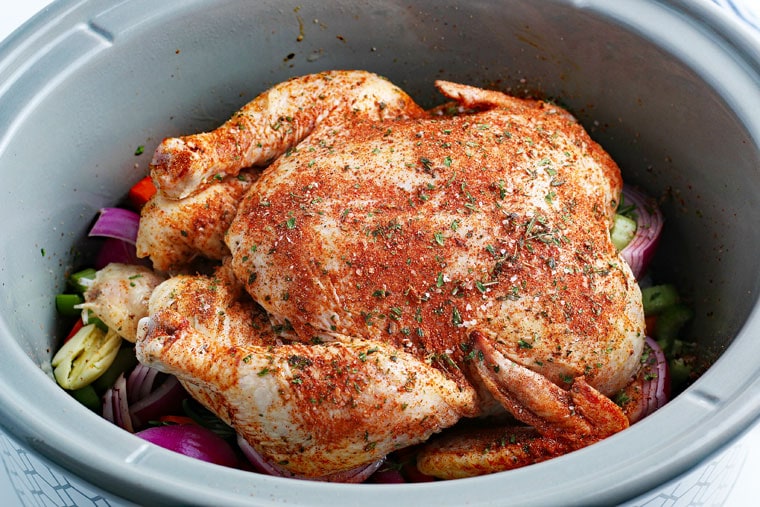 Cooking a chicken in a slow cooker.
