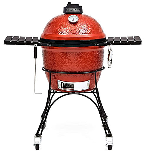 A red Kamado Joe Classic I Charcoal Grill with shelving, cart and grilling accessories.