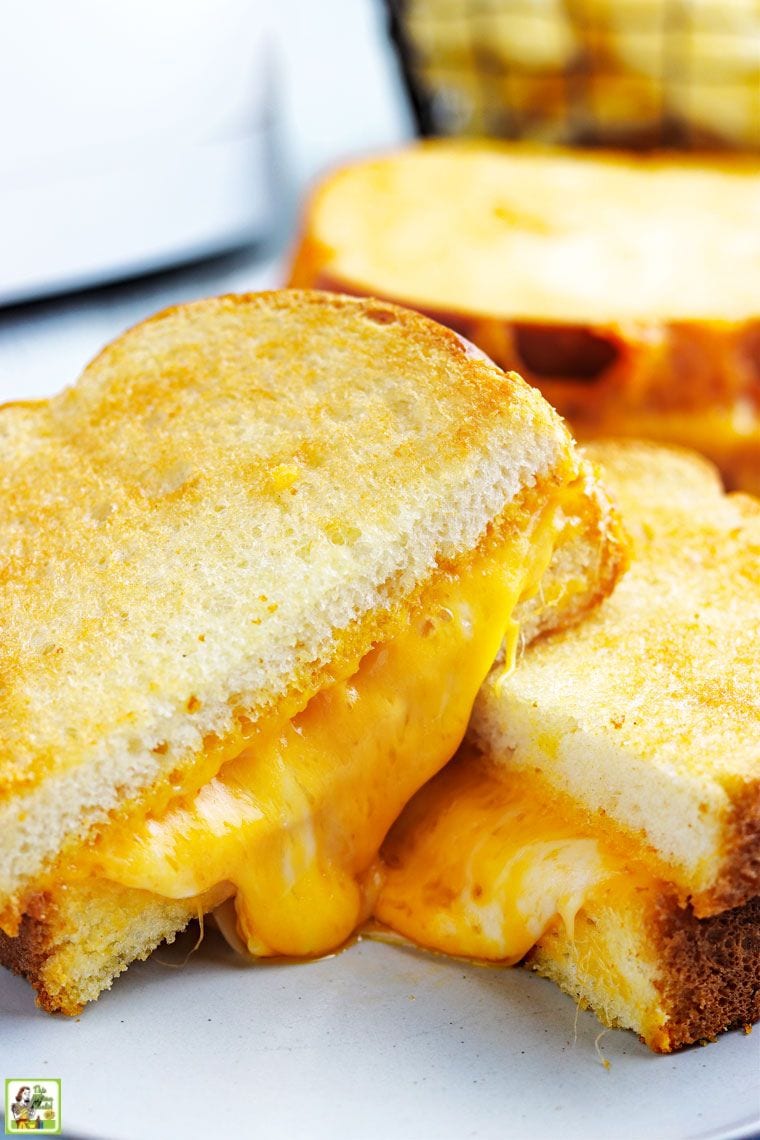 Sliced and stacked gooey grilled air fryer grilled cheese sandwich.